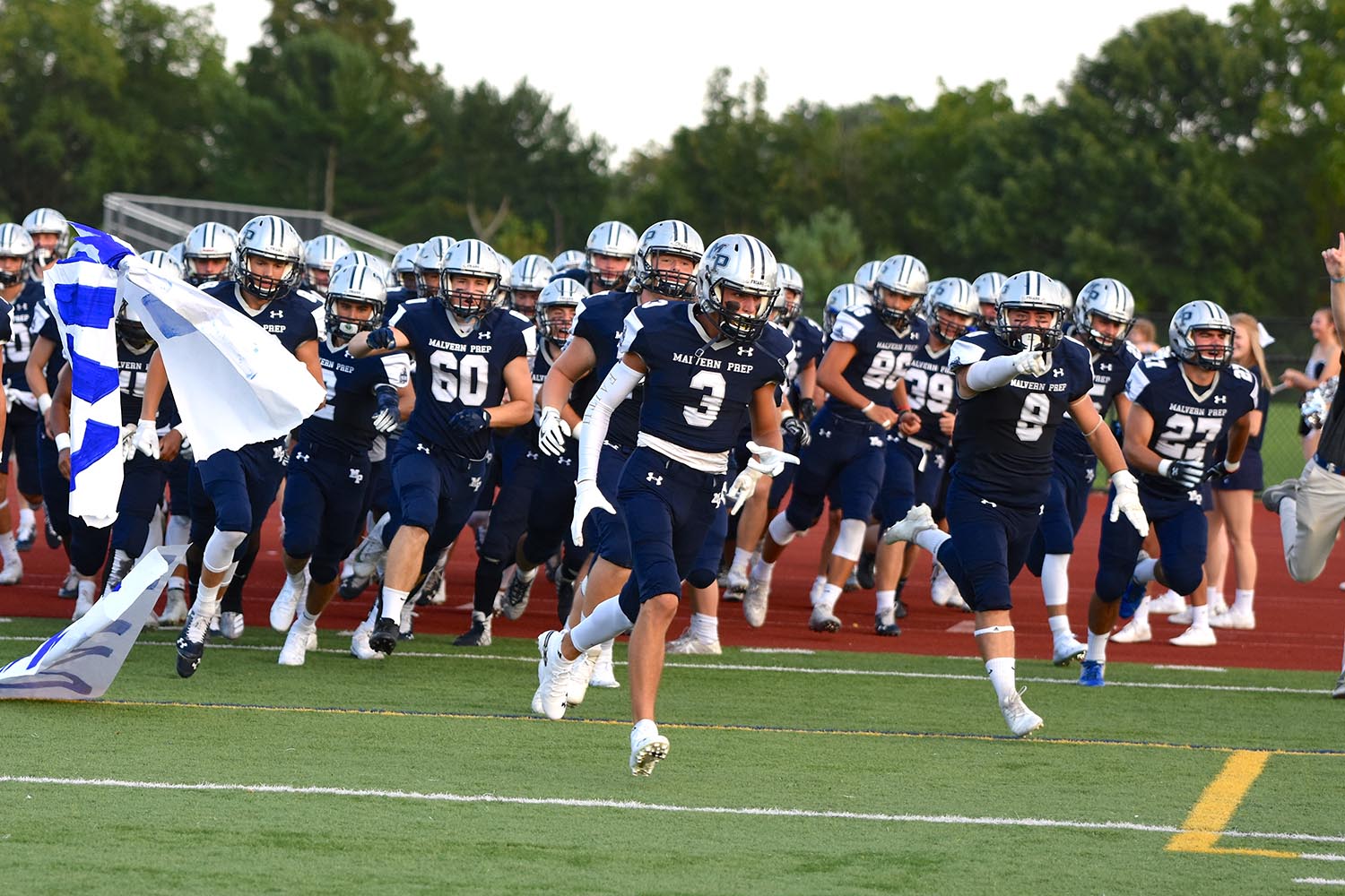 Malvern Prep Football runs onto the field!