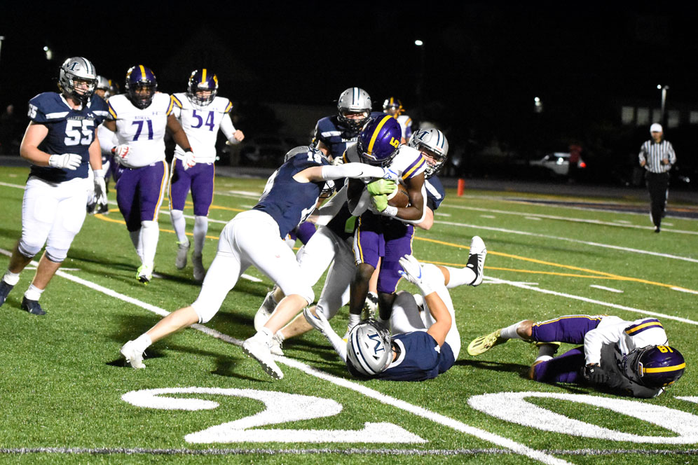 The Defense Making Tackles
