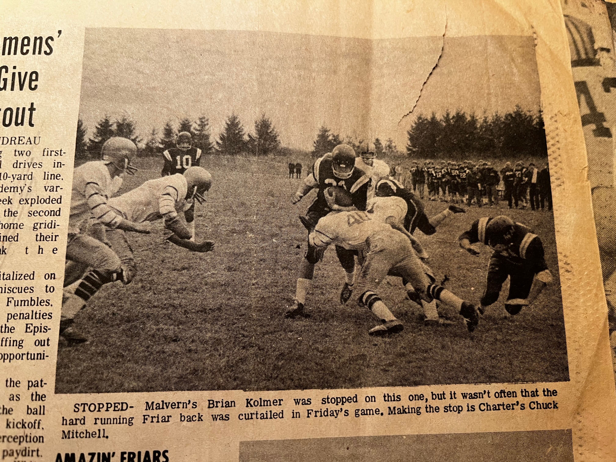 Malvern's Brian Kolmer was stopped on this one, but it wasn't often that the hard running Friar was curtailed in Friday's game. Making the stop is Charter's Chuck Mitchell