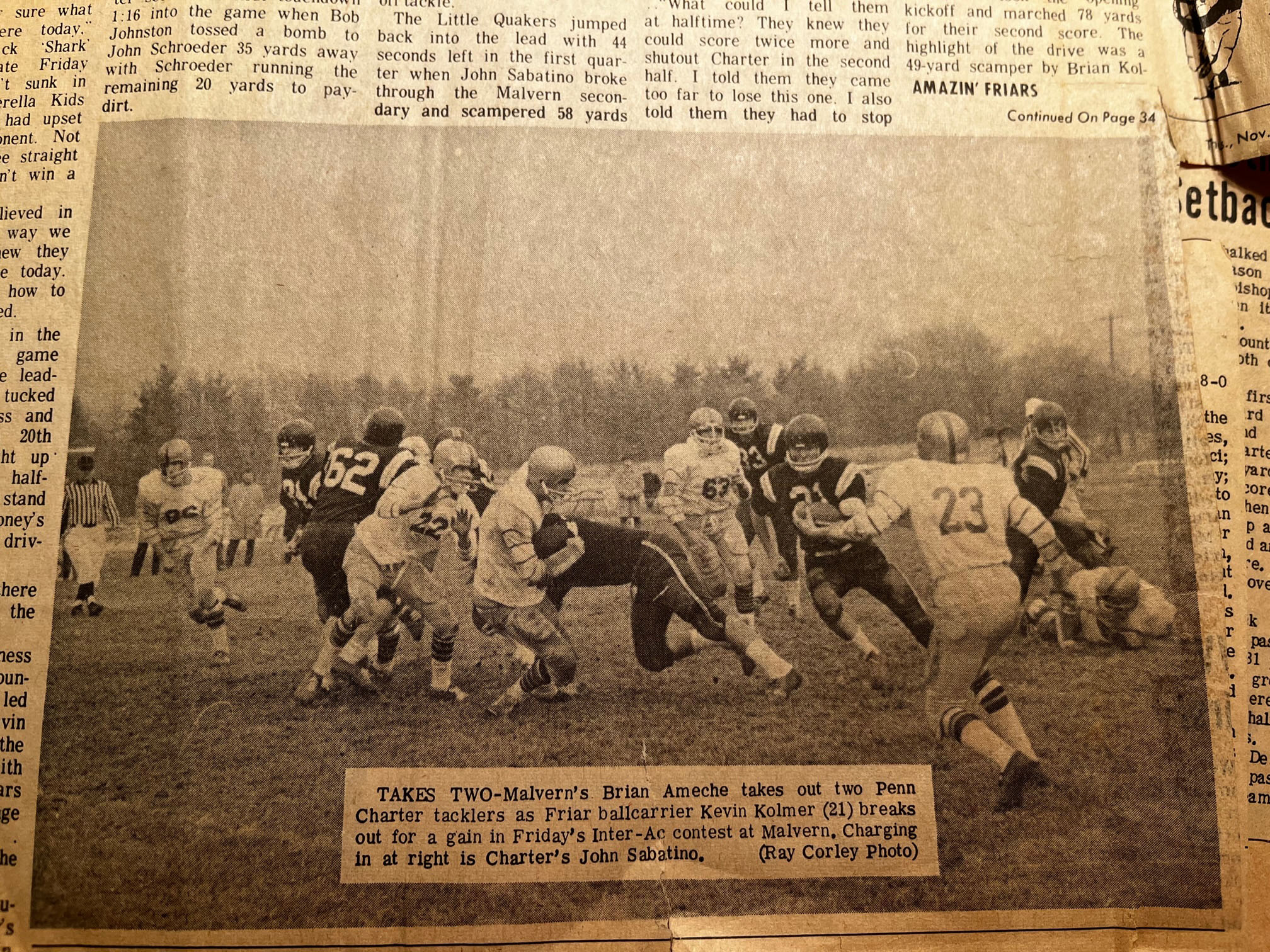 Brian Ameche takes out two Penn Charter tacklers as Friar ballcarrier Kevin Kolmer 21 breaks out for a gain in Friday's Inter-AC contest at Malvern. Charging in at the right is Charter's John Sabatino.