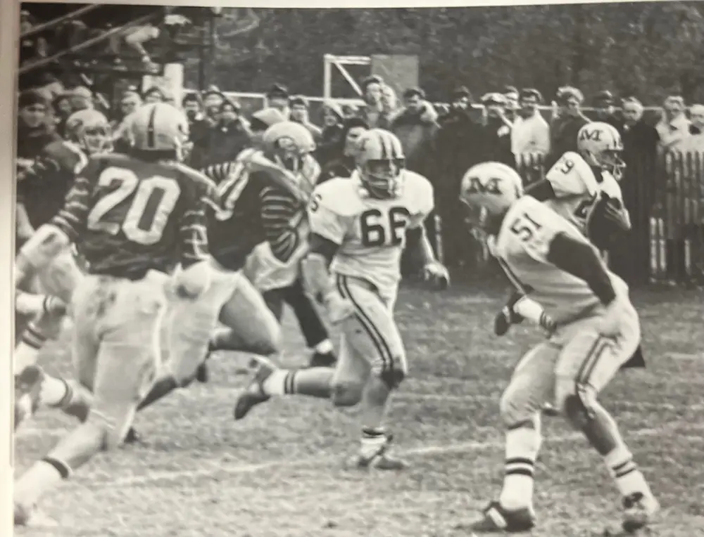 Malvern running the ball near blockers
