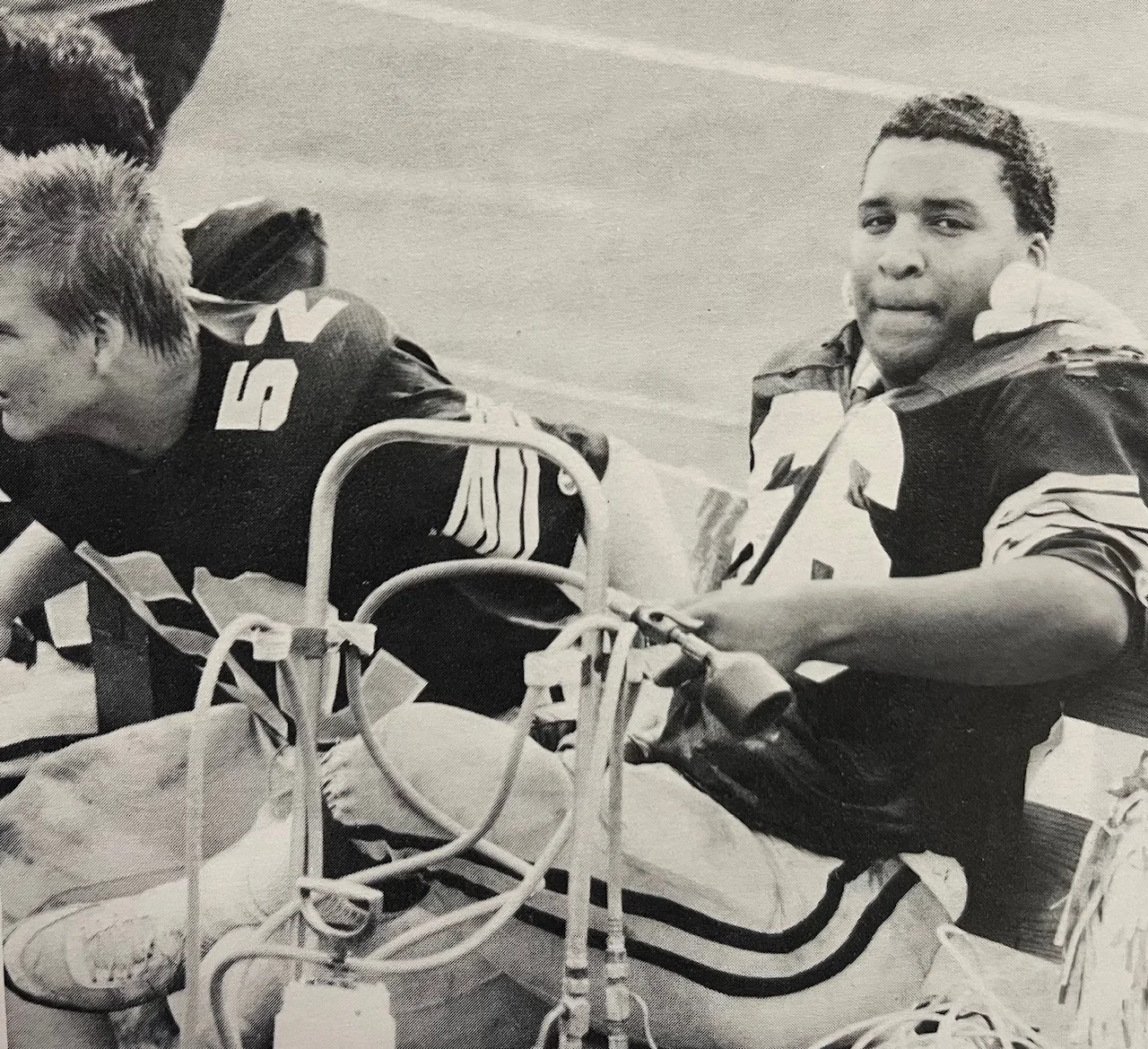1984 Malvern Prep player relaxing on the sidelines during the game