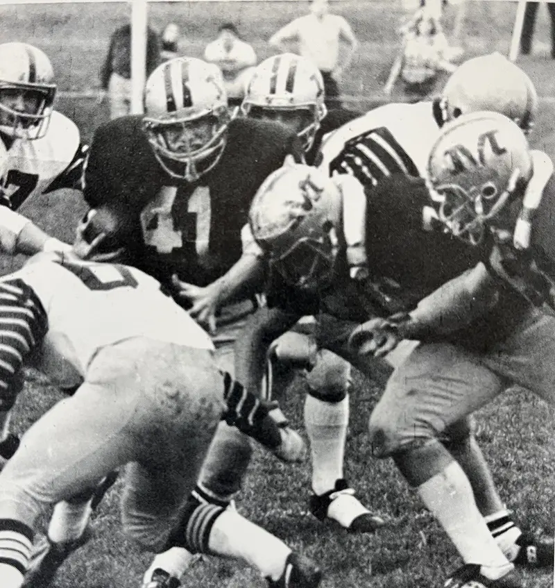 Malvern RB carrying the ball against the defense
